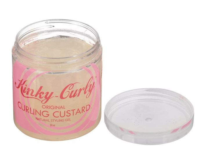 The transparent container holds a yellow-tinted custard and features a pink and red design with the words 