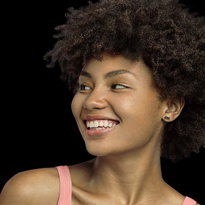 A model showcasing their hair after using the shampoo