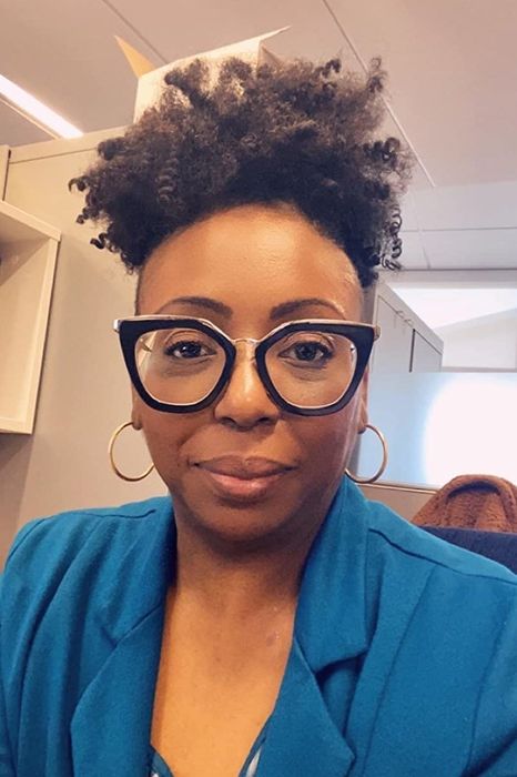 A reviewer showcasing their hair after using the shampoo