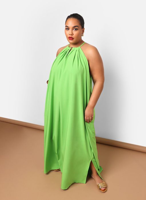 Woman modeling a graceful halter-neck dress for a shopping feature