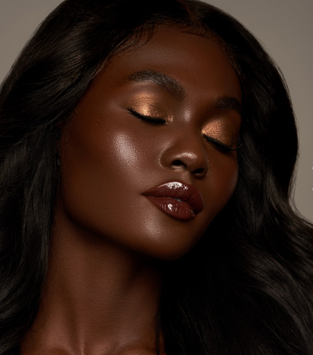 Another model featuring the pigments on their cheeks, lips, and eyes