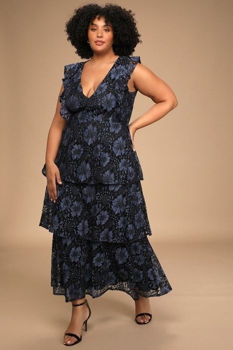 A figure showcasing the elegance of a blue lace dress