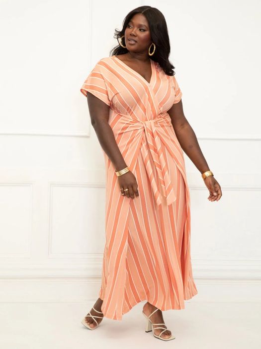 Model showcasing the coral dress