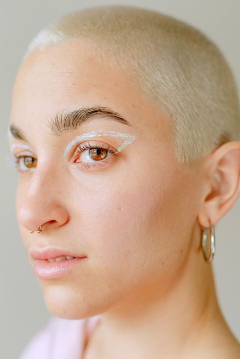 model showcasing glittery eyeliner applied around their eye