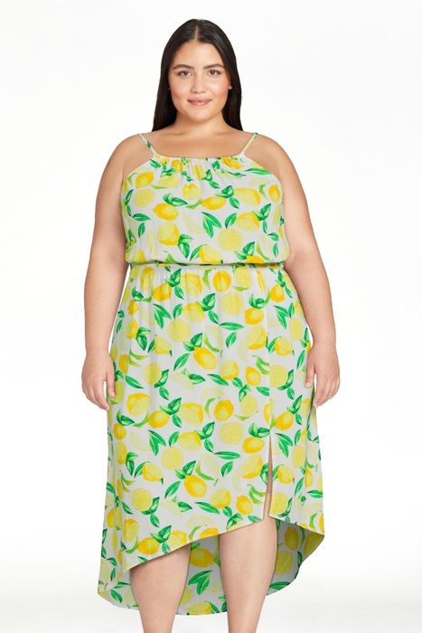 A model gracefully wearing the dress, highlighting its chic and timeless design.