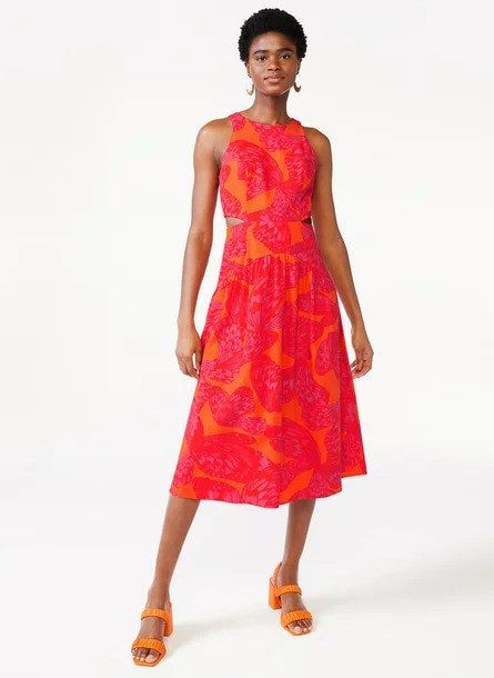 Model showcasing the orange-red dress