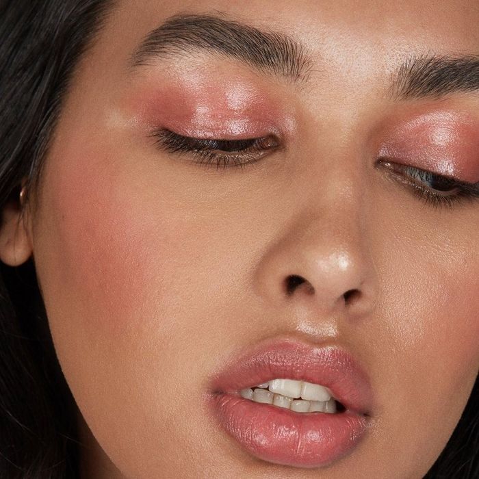 a model wearing the product on both their eyelids and lips