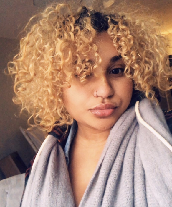 reviewer showcasing the lip gloss