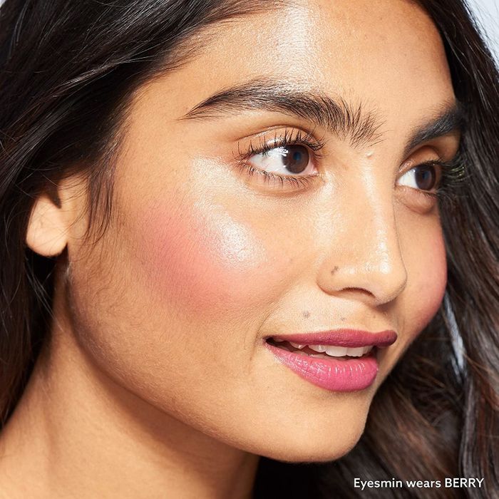 a model wearing the Berry shade of blush, illustrating its appearance on South Asian skin tones