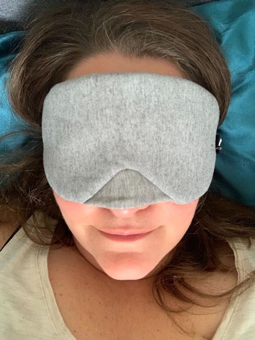 A reviewer wearing the grey mask