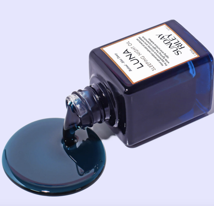 the facial oil with a blue tint