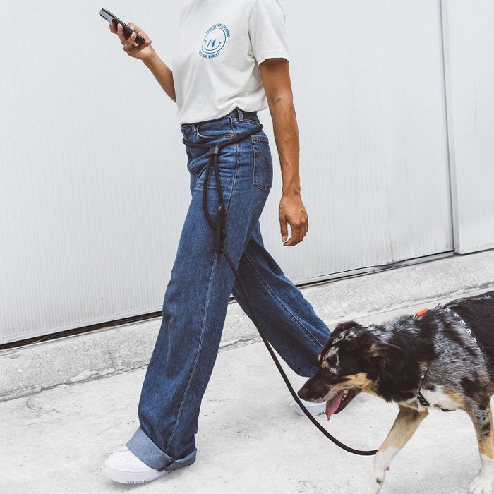 A model showcasing the leash secured around their waist.