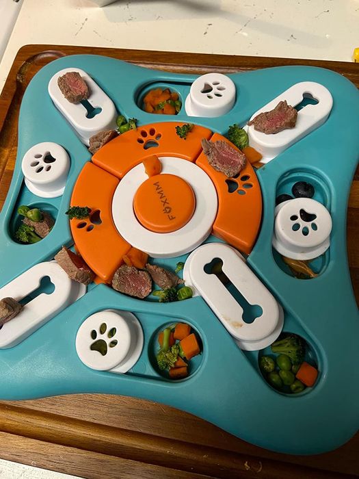 Photo from a reviewer showing the puzzle toy with food