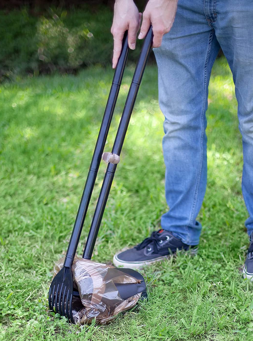 A model is seen using the swivel bin and rake pooper scooper.