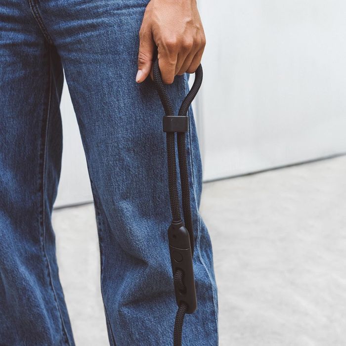 A model holding the leash in their hand.