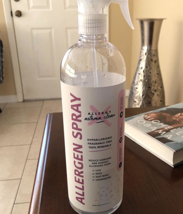 A reviewer's photo of the allergen spray bottle.