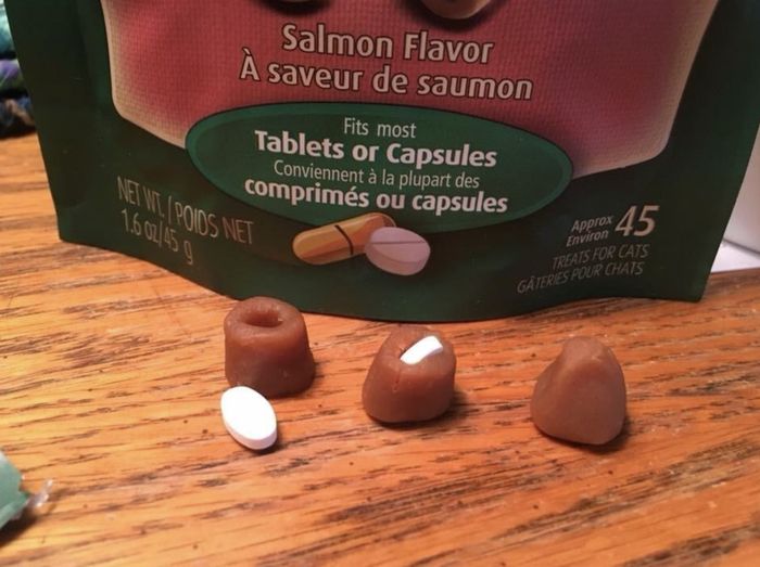Three Greenies treats: one with a pill placed outside it, one with a pill tucked inside it, and one with the pill hidden completely inside the treat, blending seamlessly.
