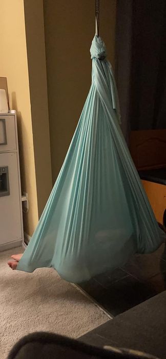 A child relaxing in a sensory swing