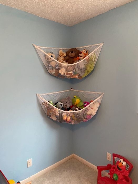 Reviewer's photo showcasing two white hammocks filled with stuffed animals