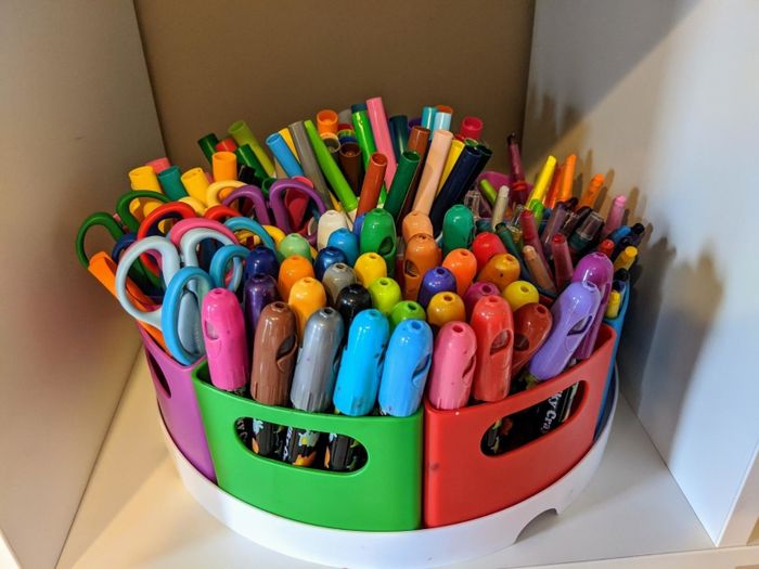 A reviewer’s photo showcasing the storage center filled with their children’s art supplies