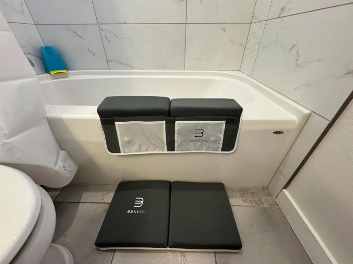The Benicci bath kneeler and elbow rest set is displayed on a bathtub, highlighting tools designed for bathroom comfort.
