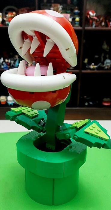 a reviewer's Lego Piranha Plant model with its mouth wide open