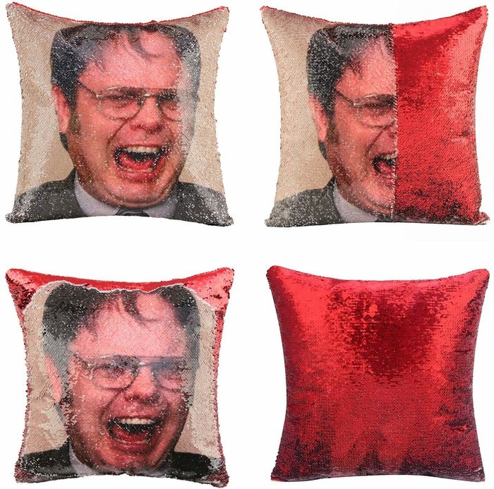 A sequin pillow that flips between an image of Dwight Schrute screaming and a bed of red sequins