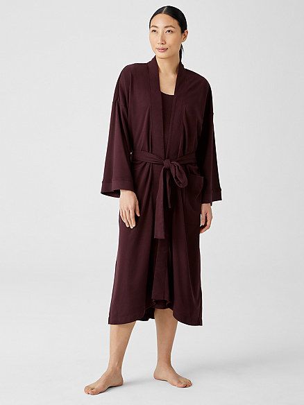 A model showcasing the maroon robe