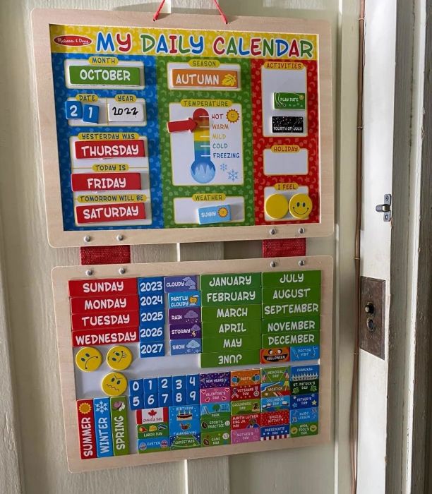 Kids' daily calendar featuring sections for days, months, weather, seasons, and activities. Comes with year markers for 2023-2027 and a thermometer illustration.