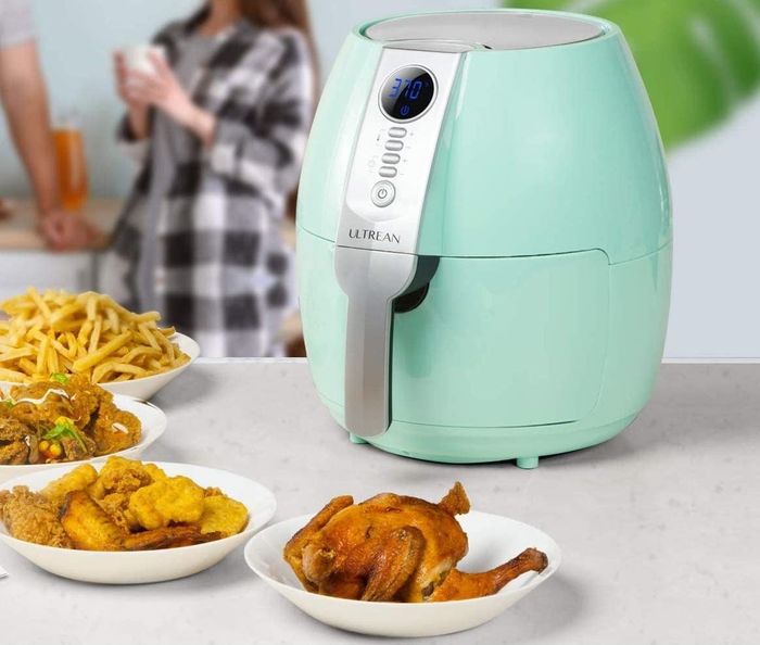 Image of an air fryer accompanied by a variety of fried dishes