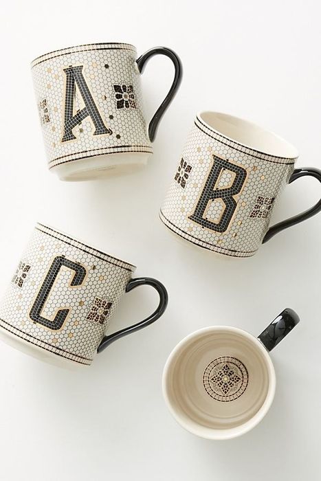 mugs featuring monograms A, B, and C, designed with a black, white, and gold vintage tile aesthetic