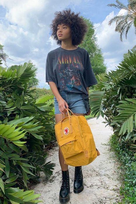 a model showcasing the yellow backpack