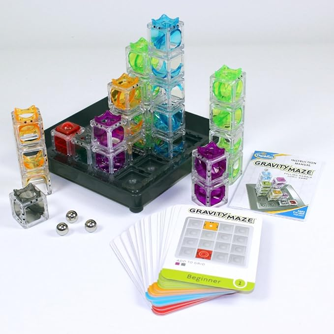 A Gravity Maze game kit showcasing vibrant towers, marbles, and instructional cards for a product feature
