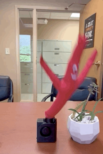 A GIF showing the wacky arm guy in motion, dancing energetically.