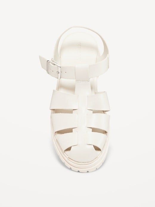 White leather strappy sandal featuring a buckle ankle strap and a chunky sole.