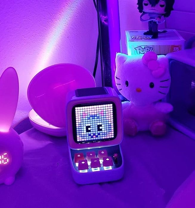 the Divoom Bluetooth speaker glowing at night