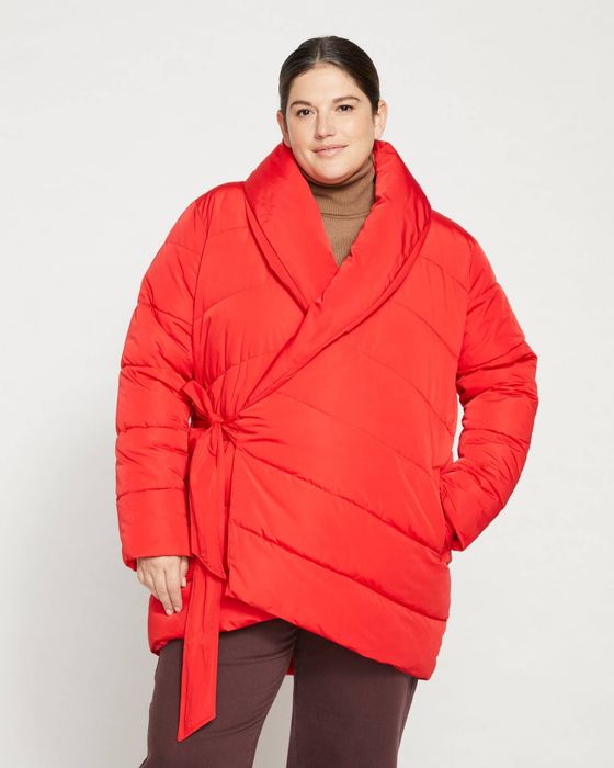 The jacket showcased in a vibrant red hue on the model