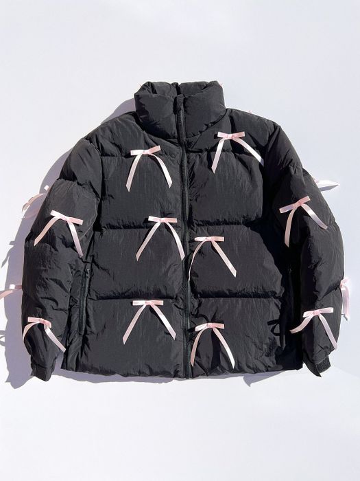 black puffer jacket featuring pink bows