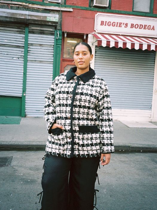 A model showcasing the houndstooth coat
