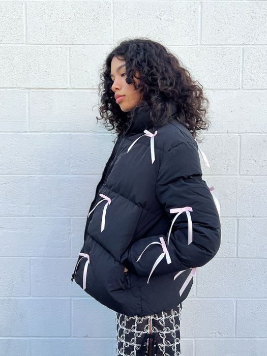 a side-angle shot of a model wearing the puffer jacket
