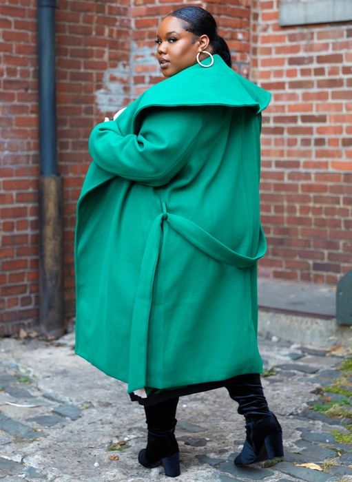 The same model showcasing the coat from the back
