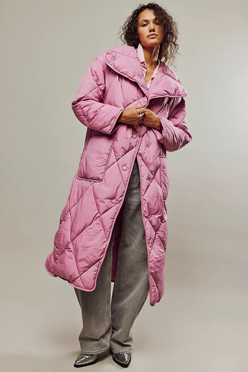 model wearing a maxi quilted pink puffer