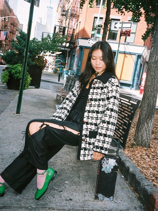 Another model wearing the coat unbuttoned