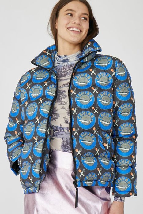 A model wearing the blue puffer jacket, viewed from the front