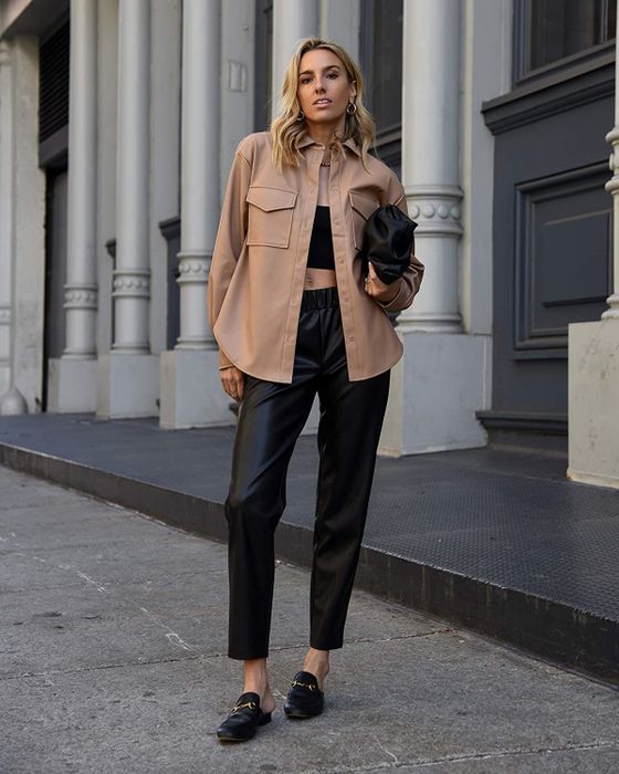 A model wearing a tan shacket.