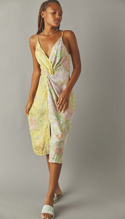 The dress features a unique half yellow, half cream design.