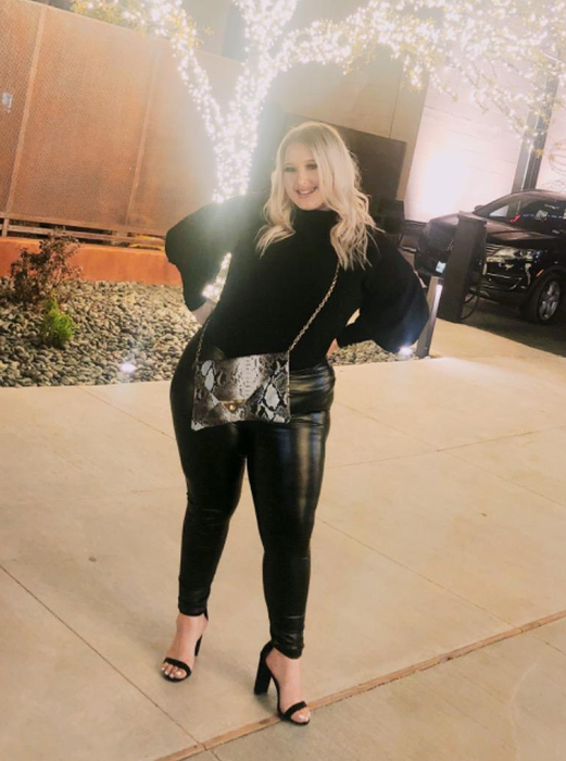 A reviewer pairing the leggings with a formal blouse and heels