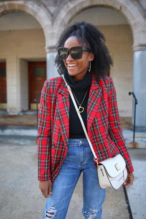 Reviewer wearing a red tartan-style blazer