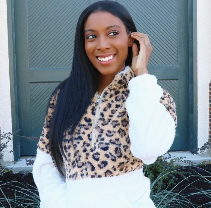 Reviewer wearing a cream and leopard print fleece