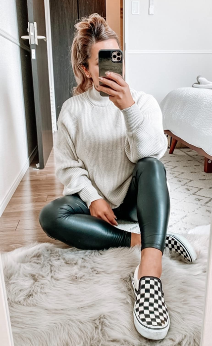 A different reviewer styling the leggings with a cozy sweater